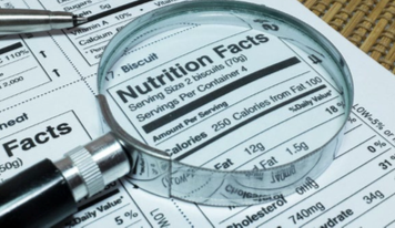 image: Magnifying glass over nutrition label